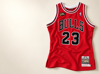 Red Chicago Bulls number 23 basketball jersey on an ivory background